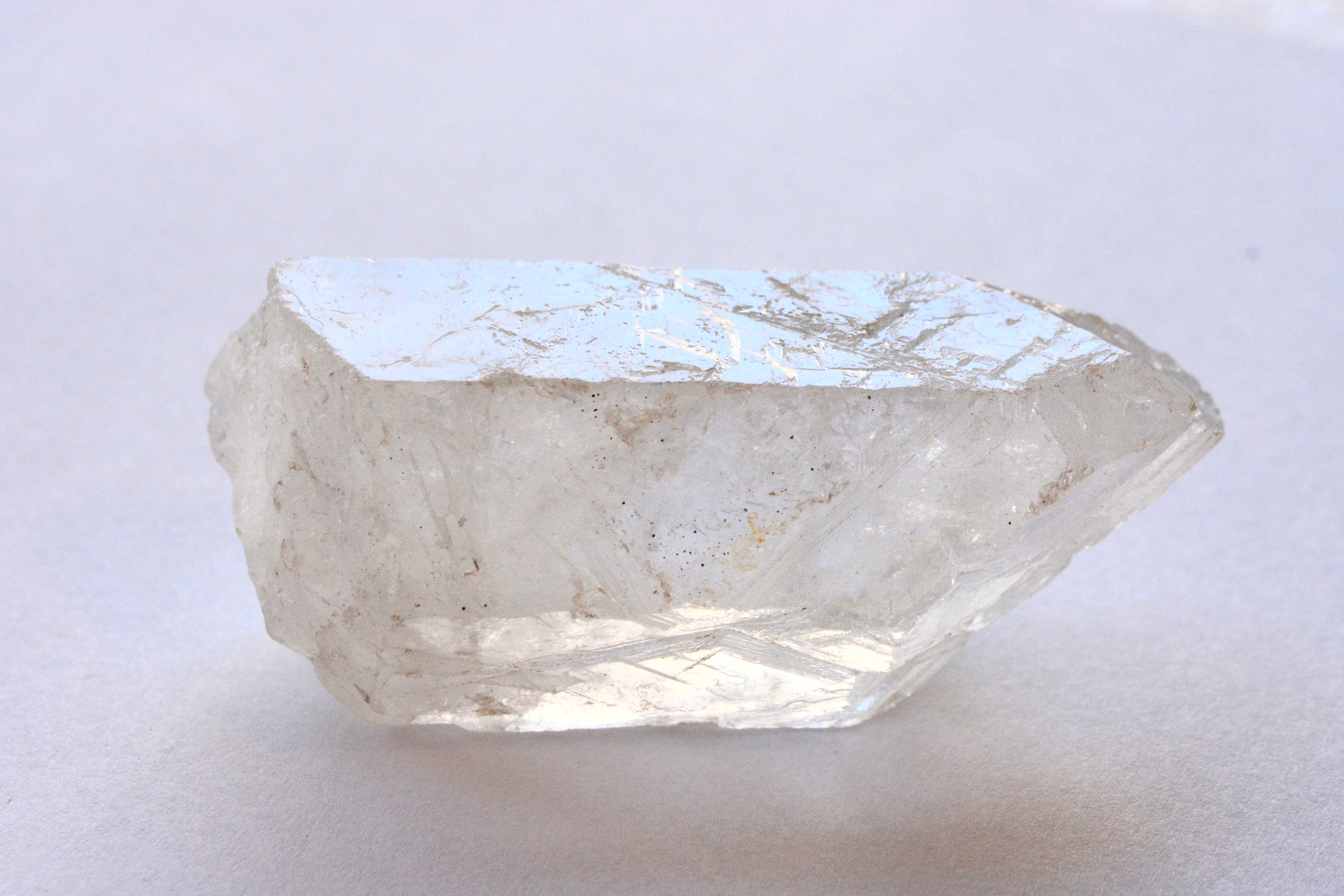 Clear quartz crystal on a white background
