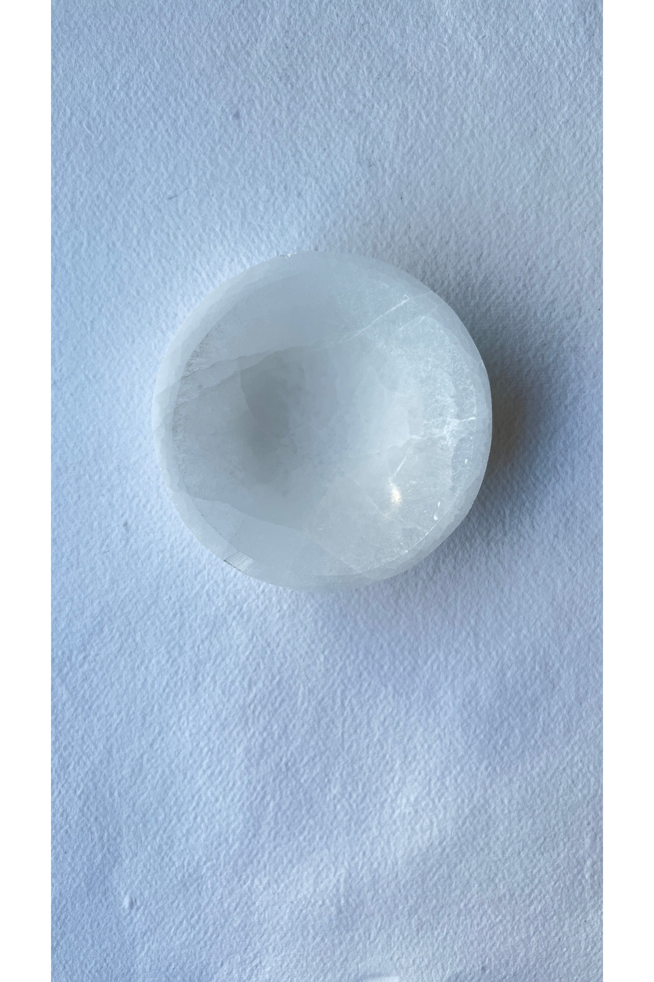 Polished selenite dish used in crystal energy rituals
