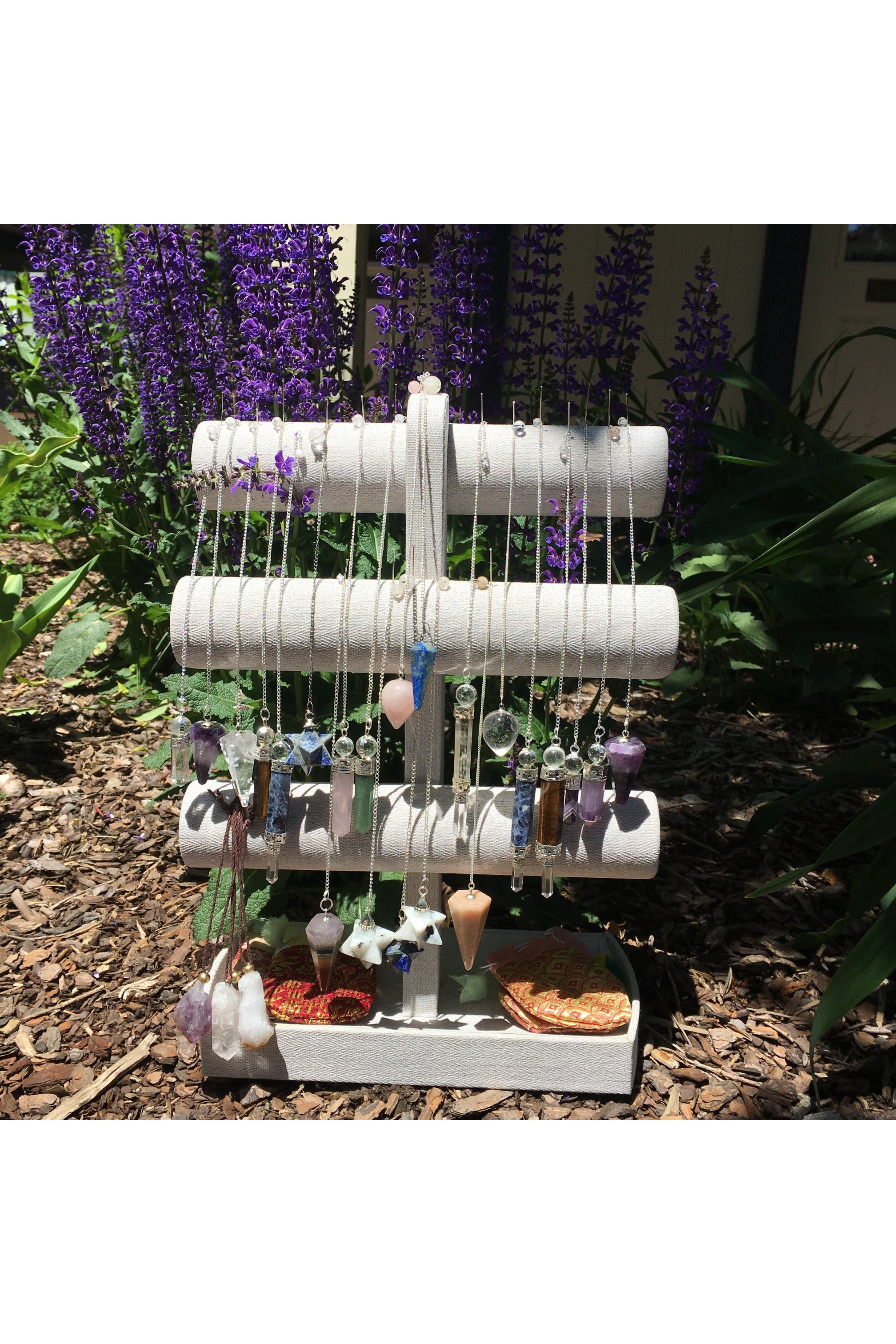 Various pendulums made from amethyst, quartz, obsidian, and orgonite