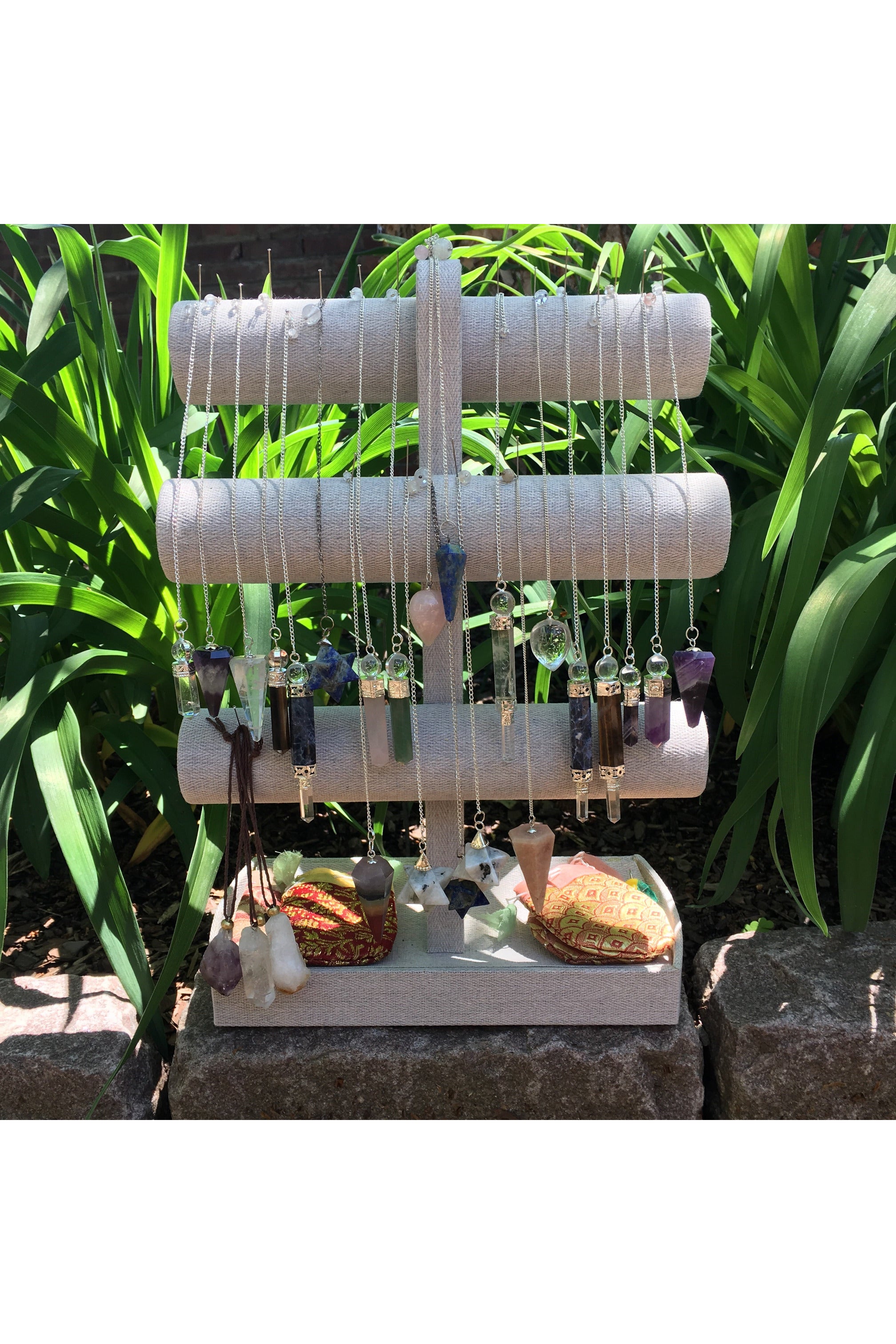 Assorted gemstone pendulums for divination and energy healing