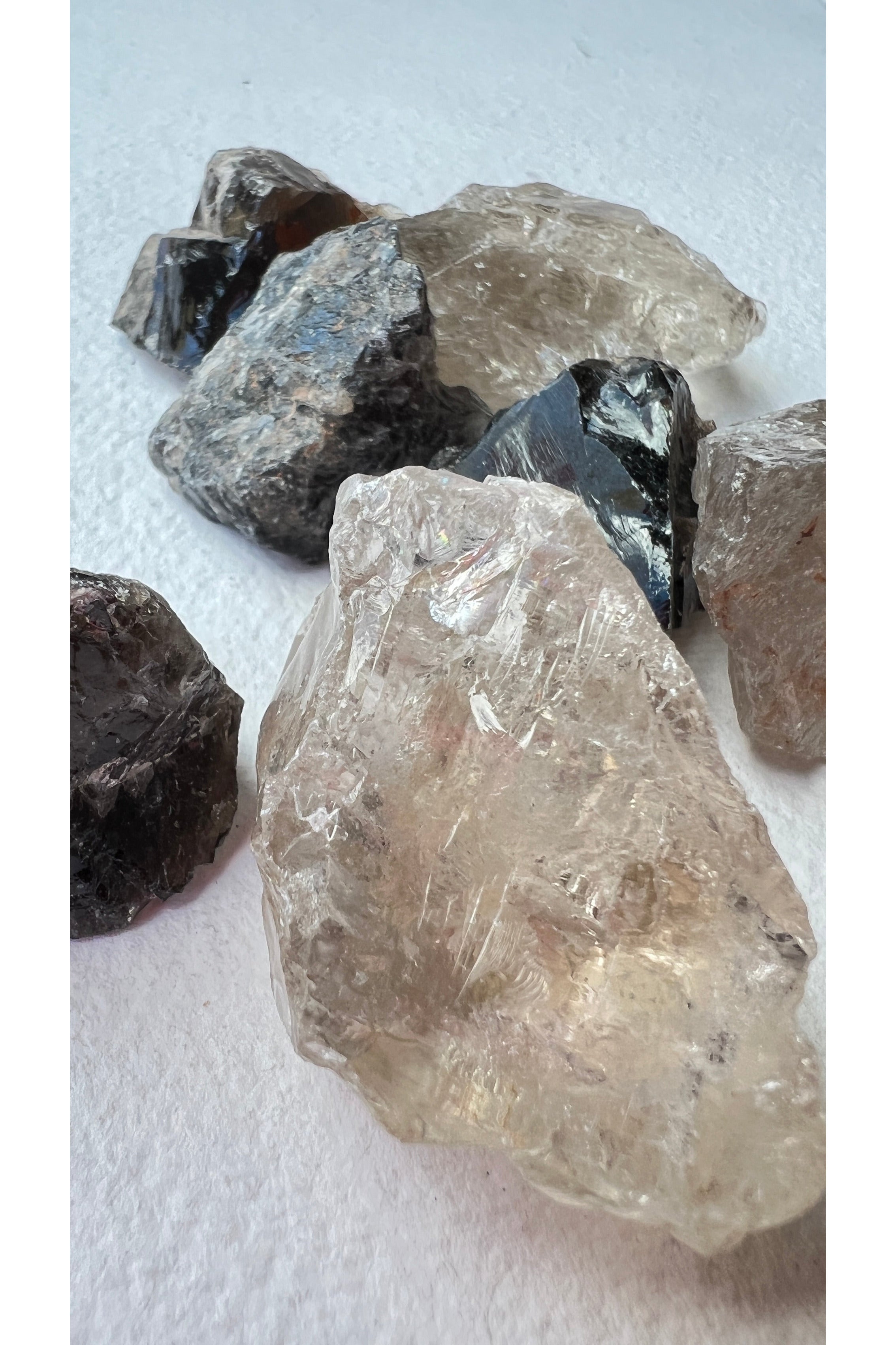 raw smoky quartz crystals with deep grey clarity and natural inclusions