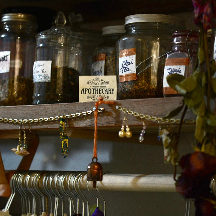 Shelf with apothecary jars and decorative items