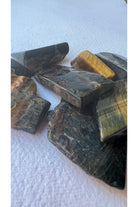 Tiger's eye polished crystal slab with golden and brown bands