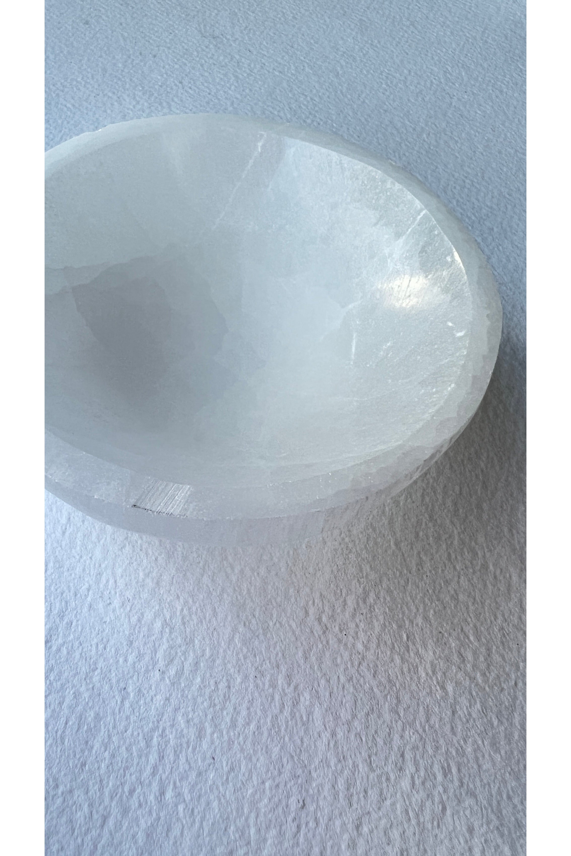 Polished selenite dish used in crystal energy rituals